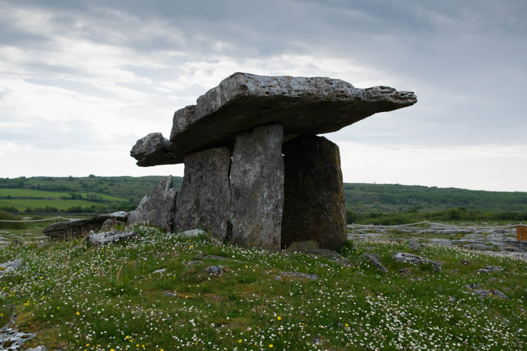 The Burren from Galway: Poulnabrone and Limestone Landscapes Poulnabrone portal tomb on the limestone plateau of the Burren, County Clare