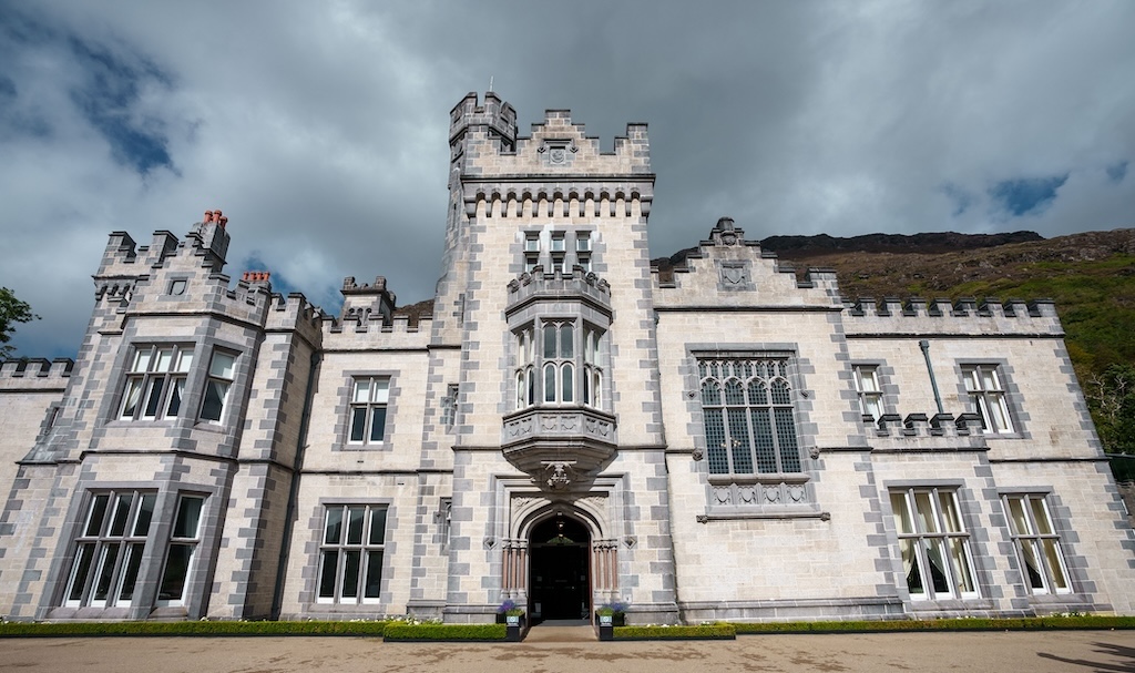 The stone facade and entrance of Kylemore Abbey in Connemara