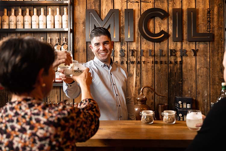 Micil Distillery Galway: Poitín, Whiskey and Gin in Salthill A host leading a tasting at the Micil Distillery visitor bar in Salthill