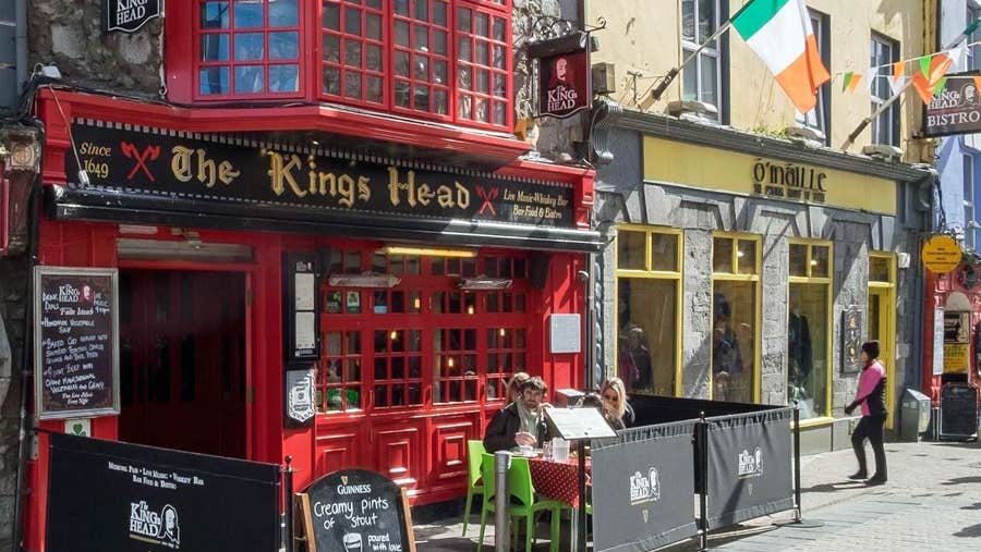 The Kings Head Galway: Historic Rooms and a Night of Live Music Red facade and bay window of The Kings Head pub on High Street, Galway