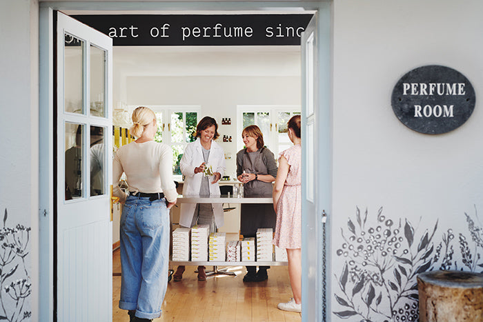 Visitors talking with a staff member inside the Burren Perfumery's Perfume Room